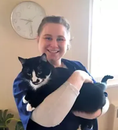 Farleigh Hodgson with a cat